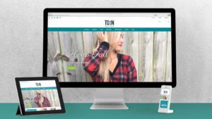 Torn Boutique's shopify site on mobile and desktop.